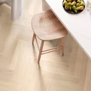 Parkwood Herringbone Albatre real oak flooring under a dining table and chair